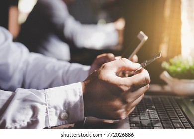 Man Using Mobile Phone To Online Shopping And Pay By Credit Card.