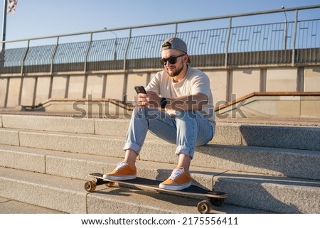 Similar – Image, Stock Photo Surfskateboarding in a sitting position