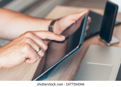 Man using mobile smart phone. Business man hands using cell phone at office desk.