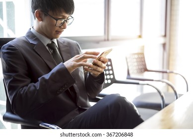 a man using mobile smart phone