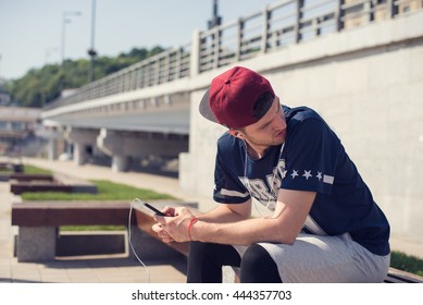 man using mobile technology during outdoors exercises