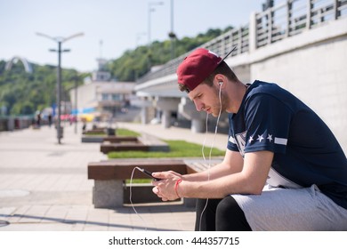 man using mobile technology during outdoors exercises