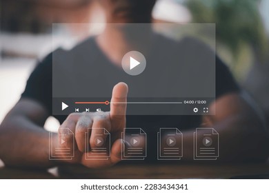 Man using mouse and keyboard for streaming online on virtual screen, watching video on internet, live concert, show or tutorial, content online.
