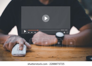 Man using mouse and keyboard for streaming online on virtual screen, watching video on internet, live concert, show or tutorial, content online.
