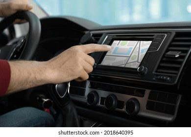 Man Using Navigation System While Driving Car, Closeup