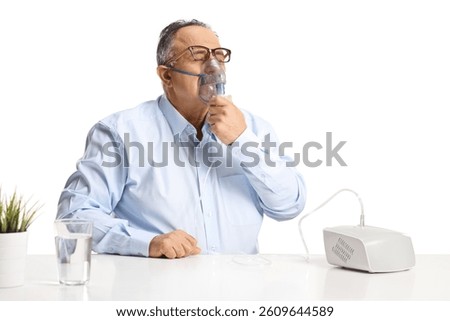 Man using a nebulizer isolated on white background