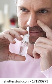 Man Using Nose Spray