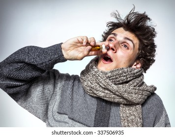 Man Using Nose Spray / Medication Or Drugs Abuse, Healthcare Concept 