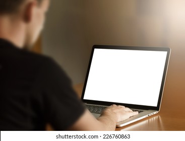 Man Using Notebook With Blank Screen In Living Room. Third Person View.