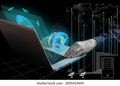 A man using a notebook computer and internet technology to connect to worldwide trading partners. Wireless, global marketing and network technology.