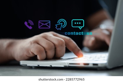 Man using a notebook with contact us or customer support hotline people connect (email, cell, message, chat). Customer support hotline contact