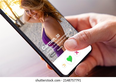 Man using online dating app on phone and viewing someone's profile photo - Shutterstock ID 2148757791