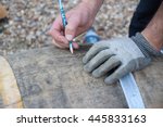 man using pencil  mark on wine barrel