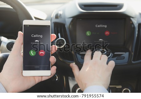 Man using phone calling system in car. Hand-free safety driving.