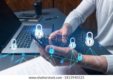 Man using phone. Hands typing smartphone. Double exposure with lock icon hologram. Close up. Datum cyber safety concept. Protection from hacker attack.