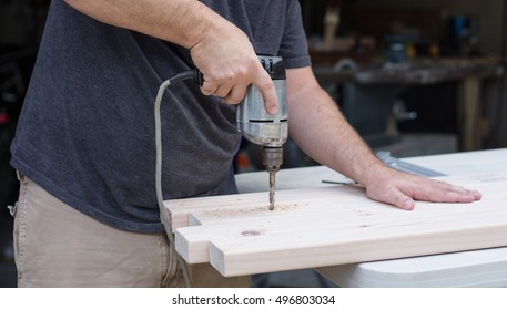 Man Using A Power Drill