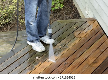 Man Using Power Washer