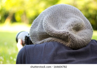 Man using a professional camera  in  the  field