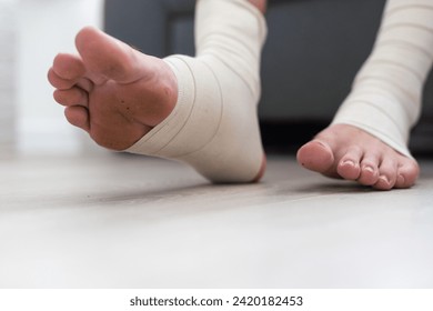 man using put on elastic bandage with legs having leg pain