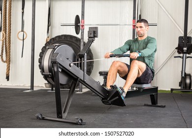 Man Using Rowing Machine In A Gym