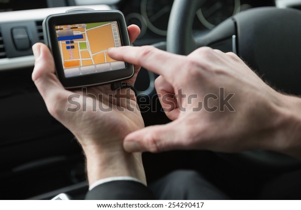 Man using\
satellite navigation system in his\
car