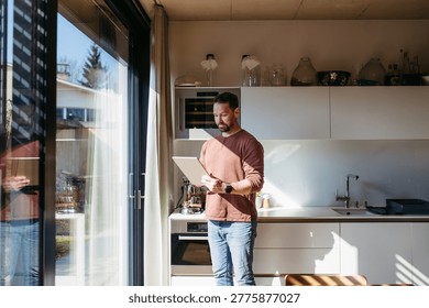 Man using smart home app to control electric window shades indoors.