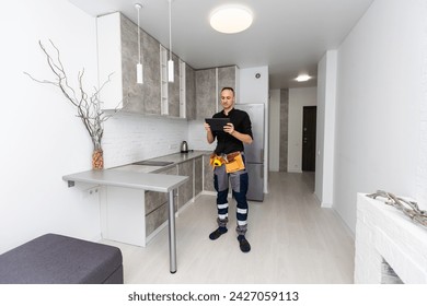 Man using smart home security system control panel