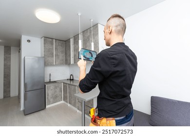 Man using smart home security system control panel