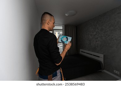 Man using smart home security system control panel