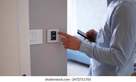 Man using smart home technology at his apartment