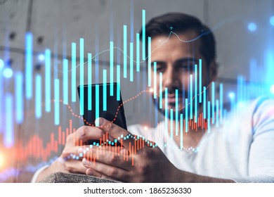 A man using smart phone. Double exposure. Forex graph hologram. Financial trading on-line brokerage concept. - Shutterstock ID 1865236330