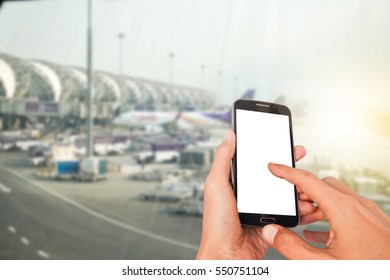 Man using smart phone mobile in the airport terminal