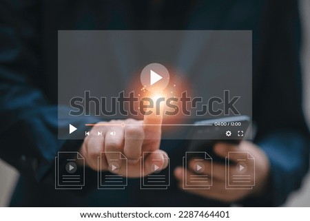 Man using smart phone for streaming online on virtual screen, watching video on internet, live concert, show or tutorial, content online.