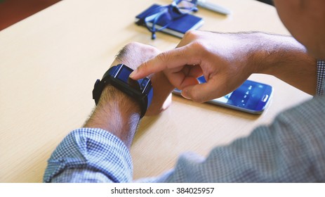 Man using smart watch.