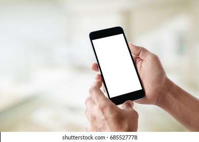 Man using smartphone at abstract blurred street night. Blank screen for graphics display montage. - Powered by Shutterstock