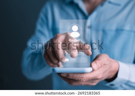 Man using a smartphone to access a virtual contact interface displaying phone number and email icon, symbolizing modern communication, contact management, and digital networking