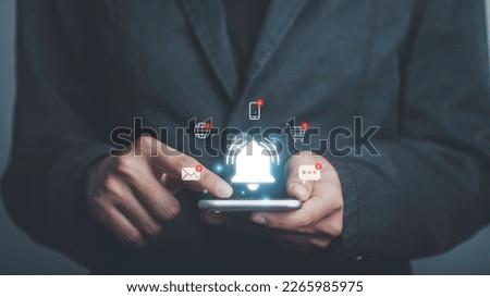 Man using smartphone with bell ringing application notification alert concept. New message, reminder, alarm ,Mail inbox, contact, New product marketing alert.