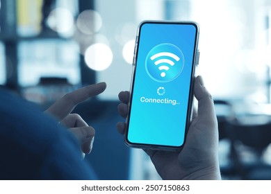 Man using smartphone connects to wireless fidelity (Wi-Fi) internet on smartphone. Concepts of technological, wireless network connections, security cyber, and WiFi encryption.