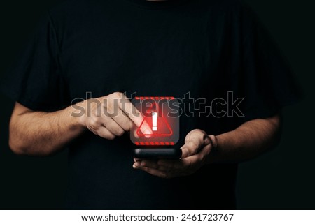Man using smartphone with cyber attack network, System hacked warning alert, virus, spyware, scam. Scammer alert and warning caution signs on mobile phone.