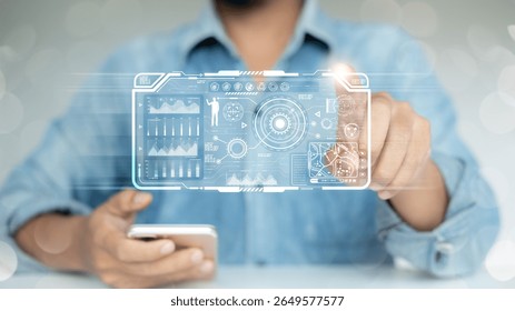 A Man using a smartphone with a futuristic digital dashboard interface and virtual data analytics, representing advanced technology, AI, and digital transformation in business.