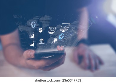 man using smartphone and icons in concept of real estate investment, energy efficiency rating and property value, Real estate online on virtual screens, home search, land price, property tax, trading - Shutterstock ID 2365347753