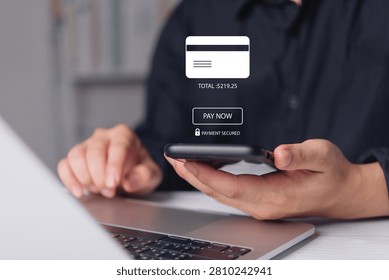 Man using smartphone and laptop for secure online payment. Digital interface shows credit card details and pay now button. E-commerce concept featuring safe transaction and financial checkout.