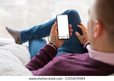 Man using smartphone. Mobile phone screen mockup.