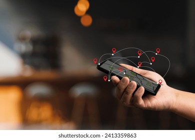 man using smartphone searching map location GPS Map to Route Destination network connection Location Street Map with GPS Icons Navigation on travel - Powered by Shutterstock