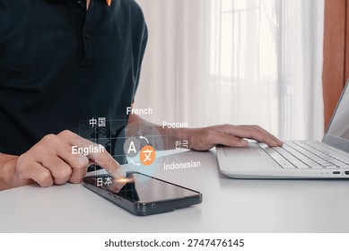 A man using a smartphone to translate different languages. Multilingual language translation concept.