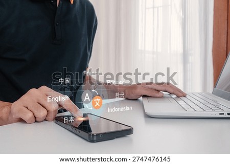 A man using a smartphone to translate different languages. Multilingual language translation concept.