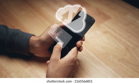 Man using smartphone with virtual cloud computing and Login virtual interfaces.Cloud computing system and internet network security technology.