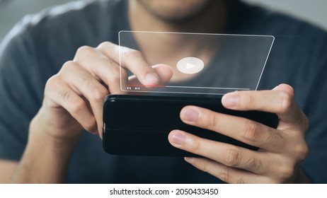 Man using smartphone for watching video on internet, online streaming, online class, content creator