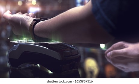 A Man Using Smartwatch To Purchase Product At The Point Of Sale Terminal In A Retail Store With Near Field Communication Nfc Radio Frequency Identification Payment Technology Use For Verification