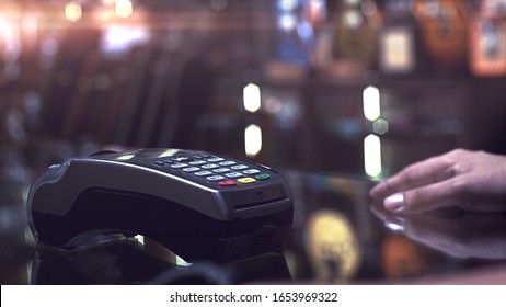 A Man Using Smartwatch To Purchase Product At The Point Of Sale Terminal In A Retail Store With Near Field Communication Nfc Radio Frequency Identification Payment Technology Use For Verification